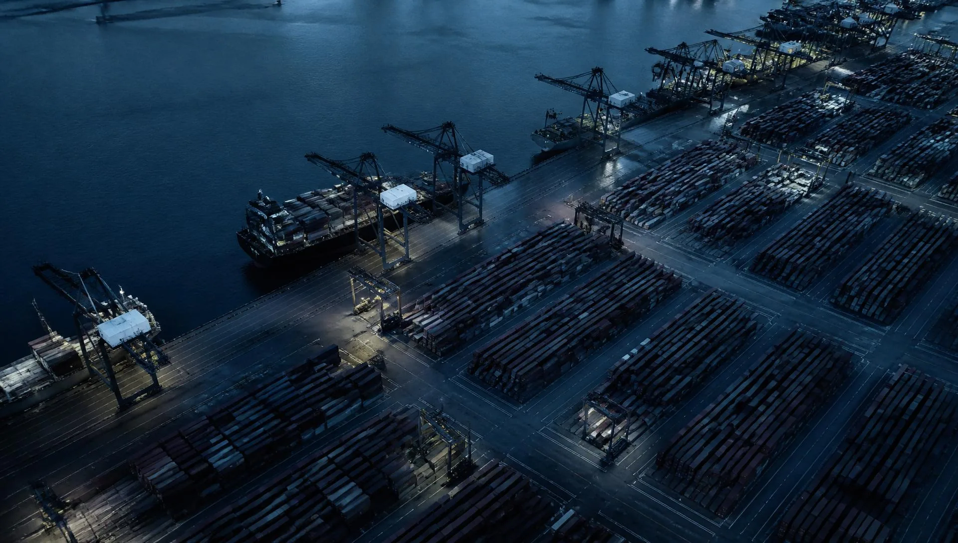 Container terminal cranes at a working port under low light